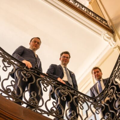 three-men-looking-down